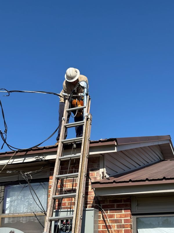 Man on a roof, making repairs.