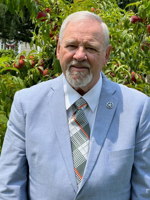 JB Kelley, Chairman smiling for a photo.